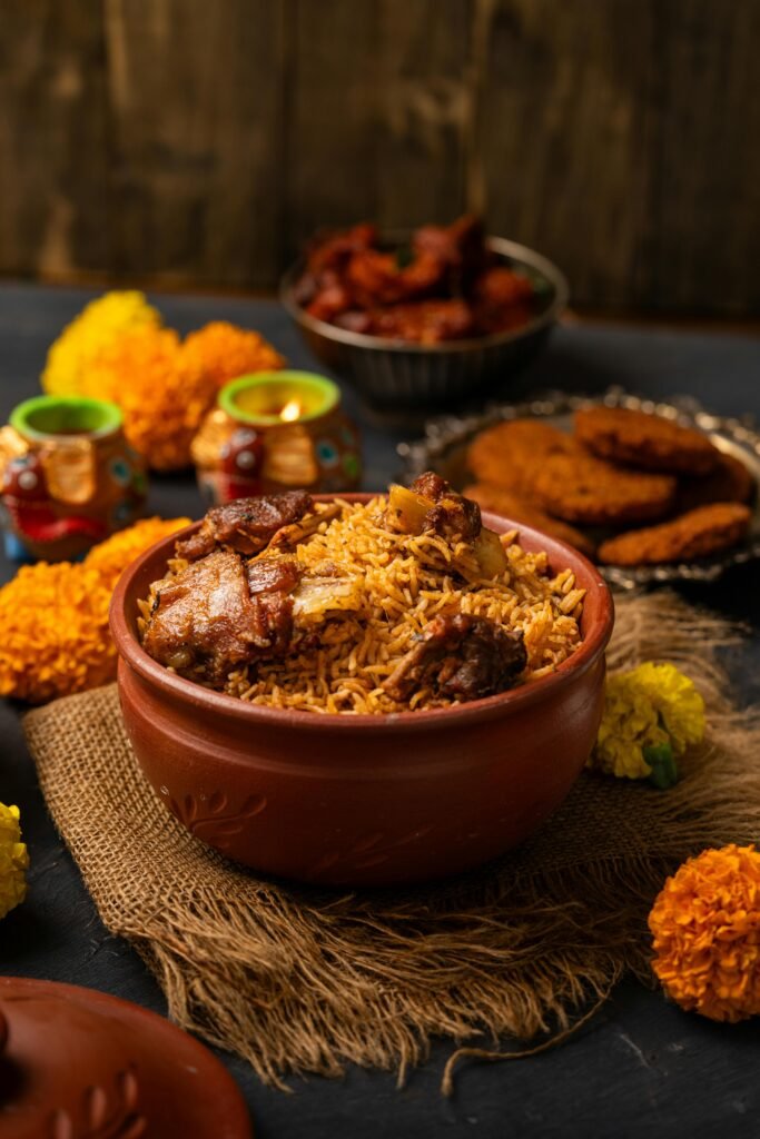 Delicious chicken biryani served in a traditional clay pot with colorful garnishes.